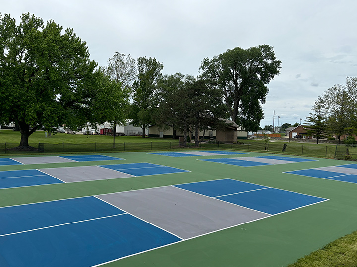 blue and gray pickleball courts recently resurfaced